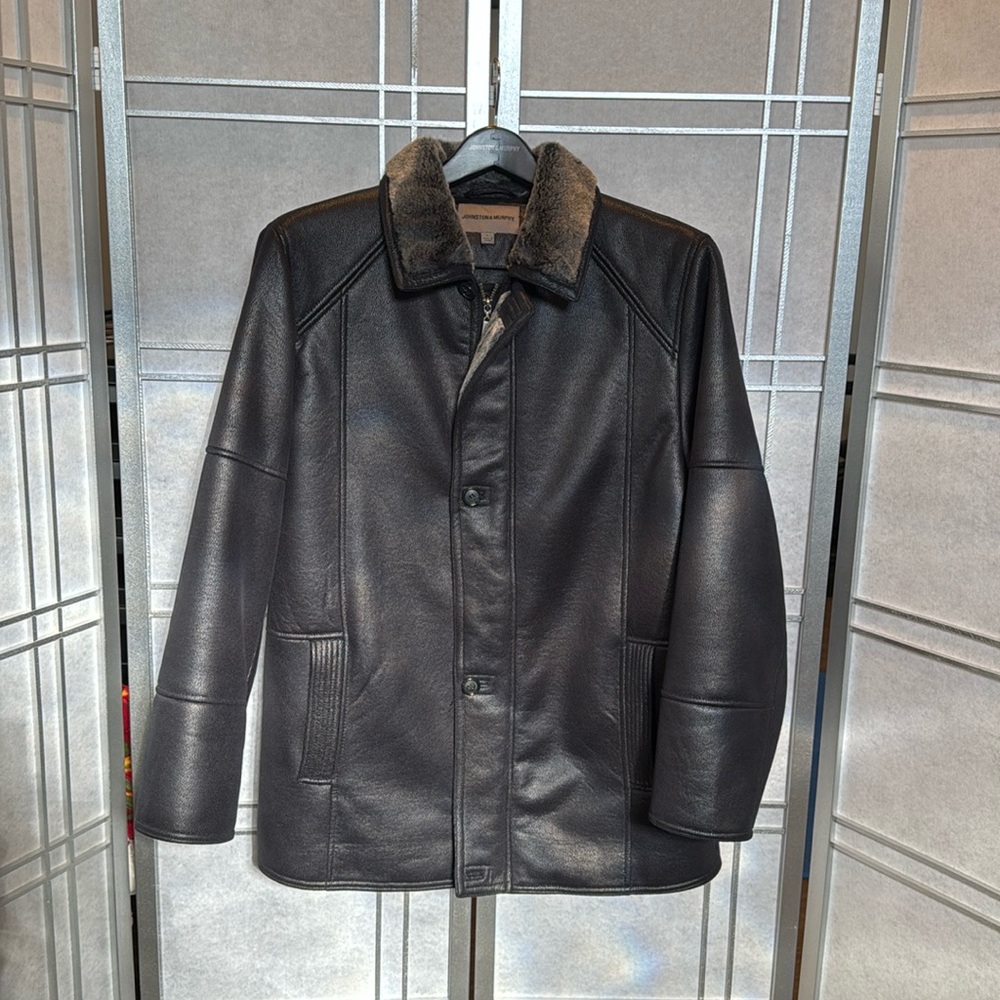 Used, synthetic leather jacket.